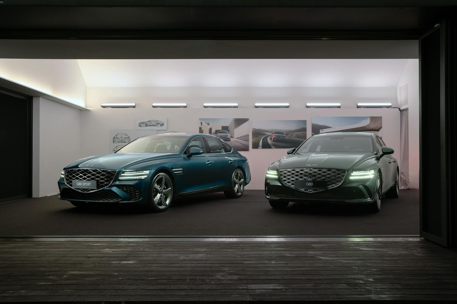 Two Genesis G80 models on display at a modern car exhibit, highlighting sleek design and luxury features.