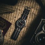 analog watch on brown textile