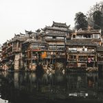 brown wooden houses beside river